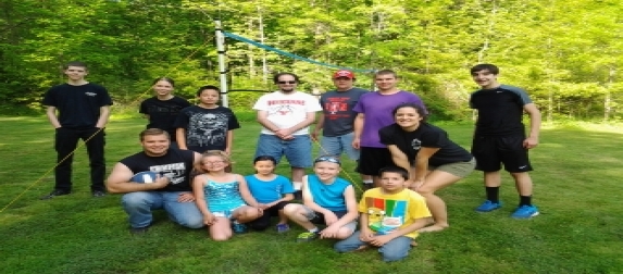 A group of young people from the church outdoors on the grass